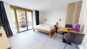 Voodi või voodid majutusasutuse Family Holiday Apartment Krone Churwalden toas +37 fotot