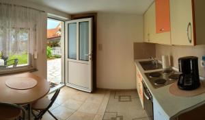 Kuchyň nebo kuchyňský kout v ubytování Apartman Dabecic