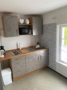 a kitchen with a sink and a counter top at Zimmer 3 am Manötscherhof in Tires