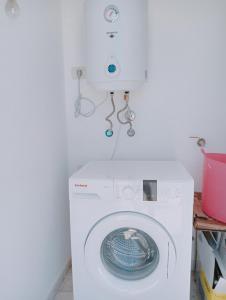 a white washer and dryer in a room at Casa Alberto in Puerto del Rosario