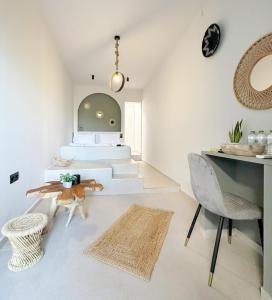 a living room with a table and chairs at Mora Houses in Mandrakia