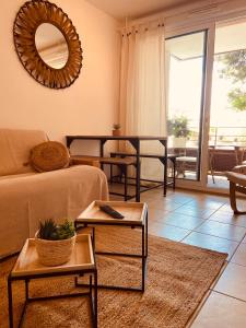a living room with a couch and a table at Chez Louis de Uzès in Uzès