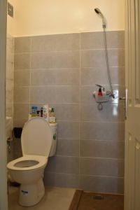 a bathroom with a toilet and a shower at Your Sweet Appartment in Fez