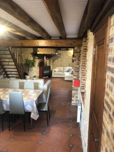 a dining room with a table and chairs at La ferte 