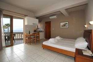 A bed or beds in a room at Stavroula Hotel Palace