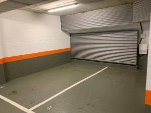 an empty parking garage with a large garage door at Hotel SANSEbay in Donostia-San Sebastián