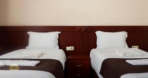 Postel nebo postele na pokoji v ubytování Hotel Parlament