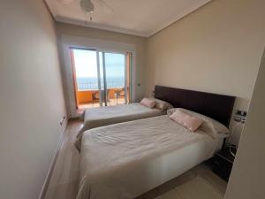 Postel nebo postele na pokoji v ubytování Vista Fraile- Atico en la Costa Cálida + 37 fotografií