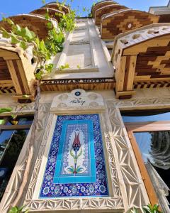 a mosaic tile on the side of a building at Saruhan Hotel in Istanbul