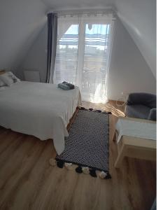 Postel nebo postele na pokoji v ubytování Domki Grażyna