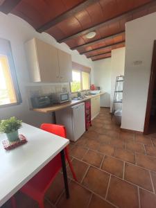 A kitchen or kitchenette at Air Conditioned "Casa Tropicana" Entire Villa or Individual Apartments