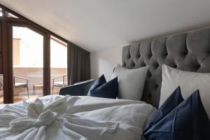Posteľ alebo postele v izbe v ubytovaní Ansitz Battisti Suites