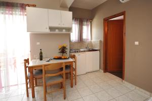 A kitchen or kitchenette at Stavroula Hotel Palace