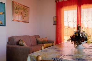 A seating area at Appartamenti Costa - BUDONI SWEET HOME Még 37 kép