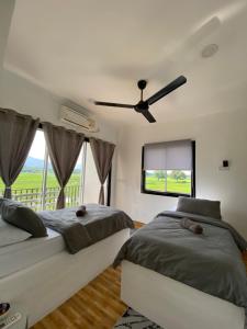 Letto o letti in una camera di LamanLeman Langkawi