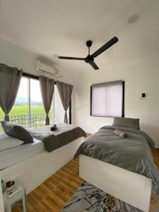 Letto o letti in una camera di LamanLeman Langkawi