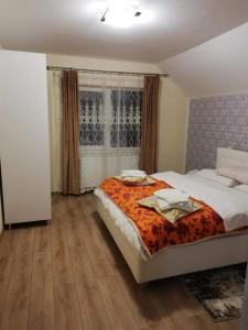 Postel nebo postele na pokoji v ubytování Casa Brănescu