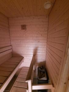 an inside of a sauna with stairs in it at Humppila Majoitus in Humppila
