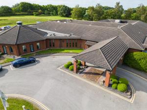 an overhead view of a house with a car in a driveway at Holiday Inn South Normanton M1, Jct.28, an IHG Hotel in South Normanton