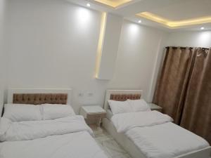 Letto o letti in una camera di Egyptus Pyramids Inn