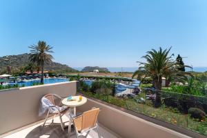 a view of the pool from the balcony of a resort at Cathrin Hotel in Faliraki