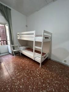 a bedroom with two bunk beds in a room at MAGENTA GUEST HOUSE in Rome