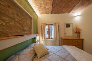 A bed or beds in a room at Affittacamere Il Bastione 27
