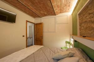 A bed or beds in a room at Affittacamere Il Bastione 27