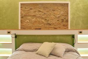 A bed or beds in a room at Affittacamere Il Bastione 27