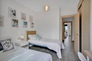 a hotel room with two beds and a hallway at 2 terraces apartment w/ astonishing views. in Costa de Antigua