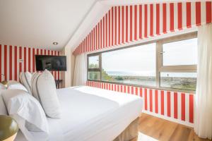 Łóżko lub łóżka w pokoju w obiekcie Hotel Barú