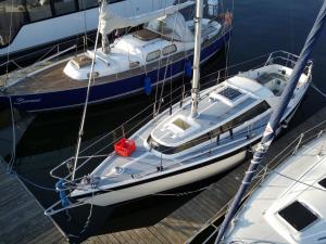 two boats docked at a dock in the water at Nocleg na jachcie Lanette w Swinoujsciu in Świnoujście