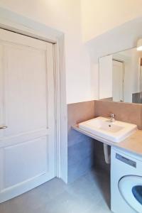 a bathroom with a sink and a mirror at Casa Brezza marina in Marina di Campo