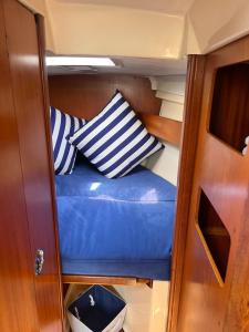 a seat in the back of a boat with pillows at Voyage du rêve in Antibes