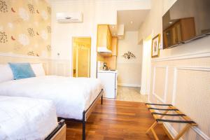 Postel nebo postele na pokoji v ubytování Parc Suites Hotel