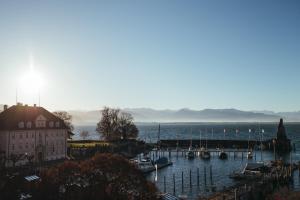 a view of a harbor with boats in the water at Hotel Lindauer Hof in Lindau