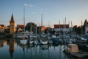 a bunch of boats are docked in a harbor at Hotel Lindauer Hof in Lindau