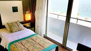 Cama ou camas em um quarto em Blue Garden Hotel
