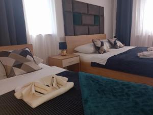 Postel nebo postele na pokoji v ubytování Studio Apartmani “Jarnečić”