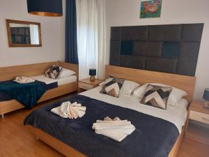 Postel nebo postele na pokoji v ubytování Studio Apartmani “Jarnečić”