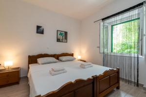 Postel nebo postele na pokoji v ubytování Filomena Rooms + 13 fotografií