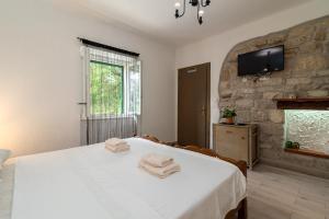 Postel nebo postele na pokoji v ubytování Filomena Rooms