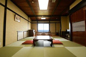 Letto o letti in una camera di 黒潮の宿 臨海荘 -Kuroshio no yado Rinkaisou-