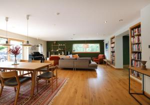 a living room with a table and a couch at Kingswood in Edinburgh