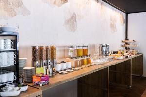 a buffet line with food on a table at Hotel Krone Churwalden 3 Sterne Superior in Churwalden