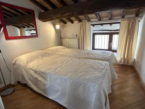 A bed or beds in a room at Trilocale in centro storico a Spoleto