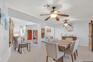 a dining room with a table and a ceiling fan at Beautiful Oasis with rv or boat parking in Las Vegas