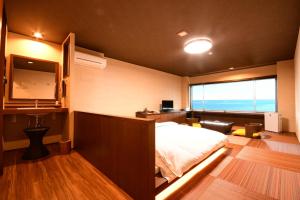 Letto o letti in una camera di 黒潮の宿 臨海荘 -Kuroshio no yado Rinkaisou-
