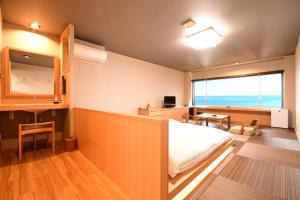 Letto o letti in una camera di 黒潮の宿 臨海荘 -Kuroshio no yado Rinkaisou-
