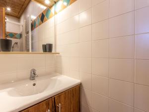 a bathroom with a sink and a mirror at Appartement La Clusaz, 4 pièces, 8 personnes - FR-1-437-71 in La Clusaz